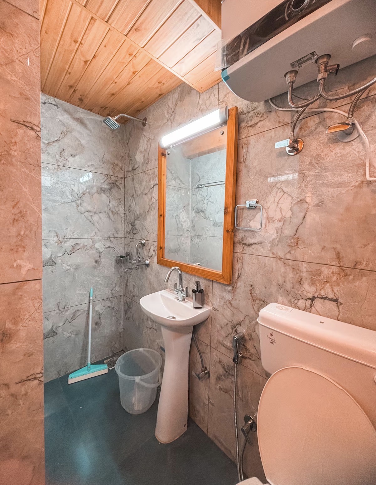 Modern marble en-suite bathroom with rain shower