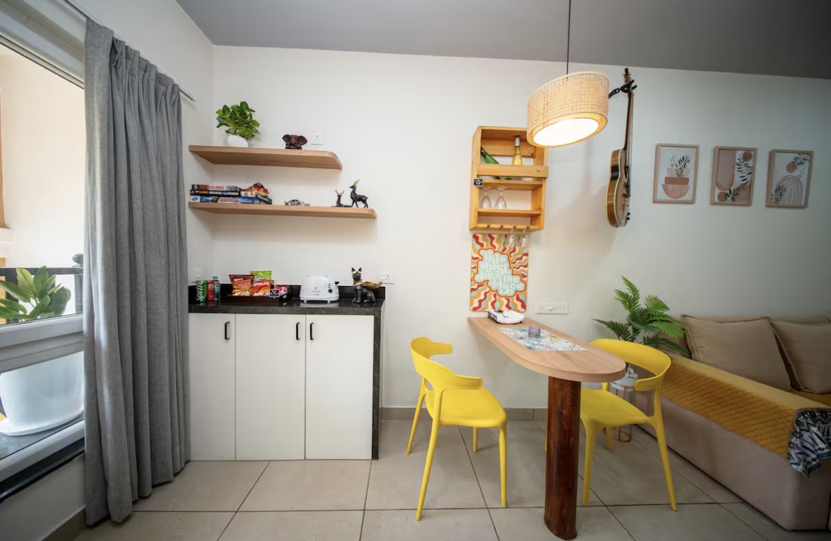 Kitchenette with pantry shelves and breakfast bar