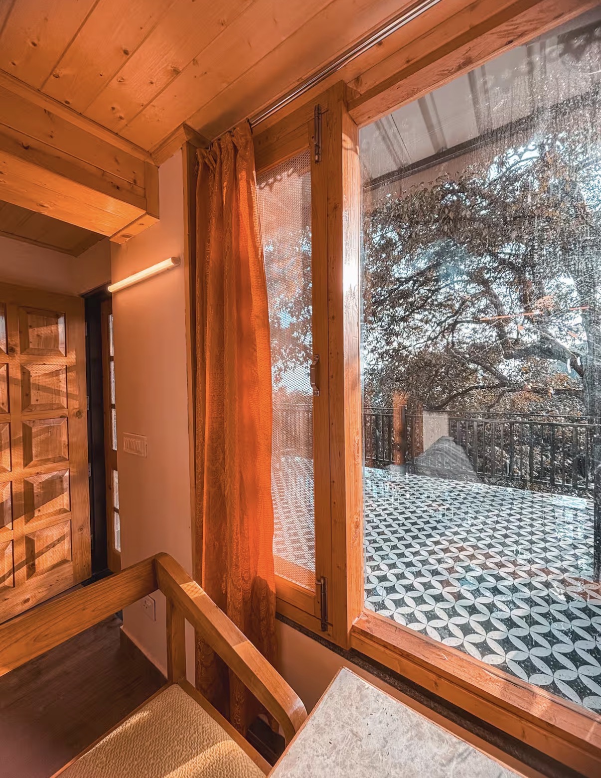 Landing with forest views through floor-to-ceiling glass